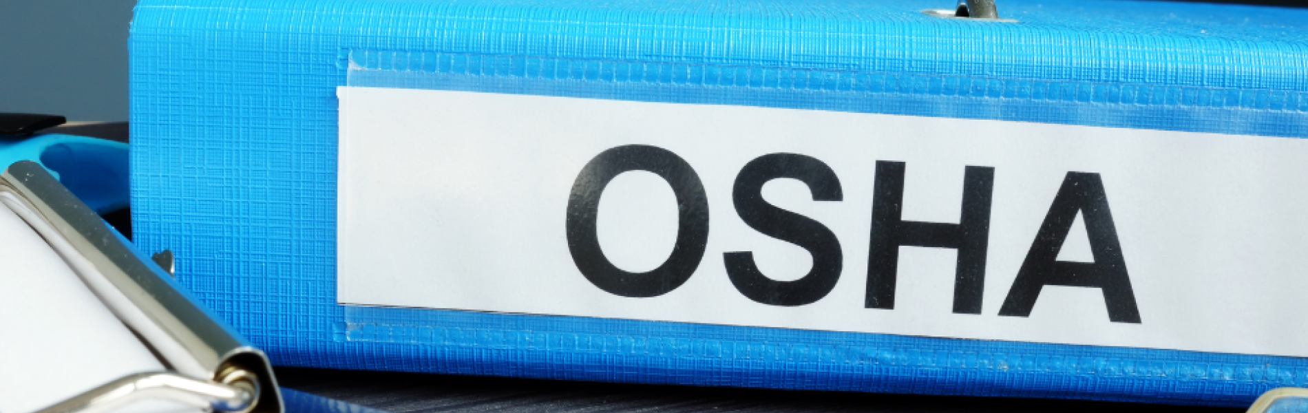 blue binder with OSHA label