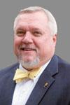 man with beard in suit and bow tie