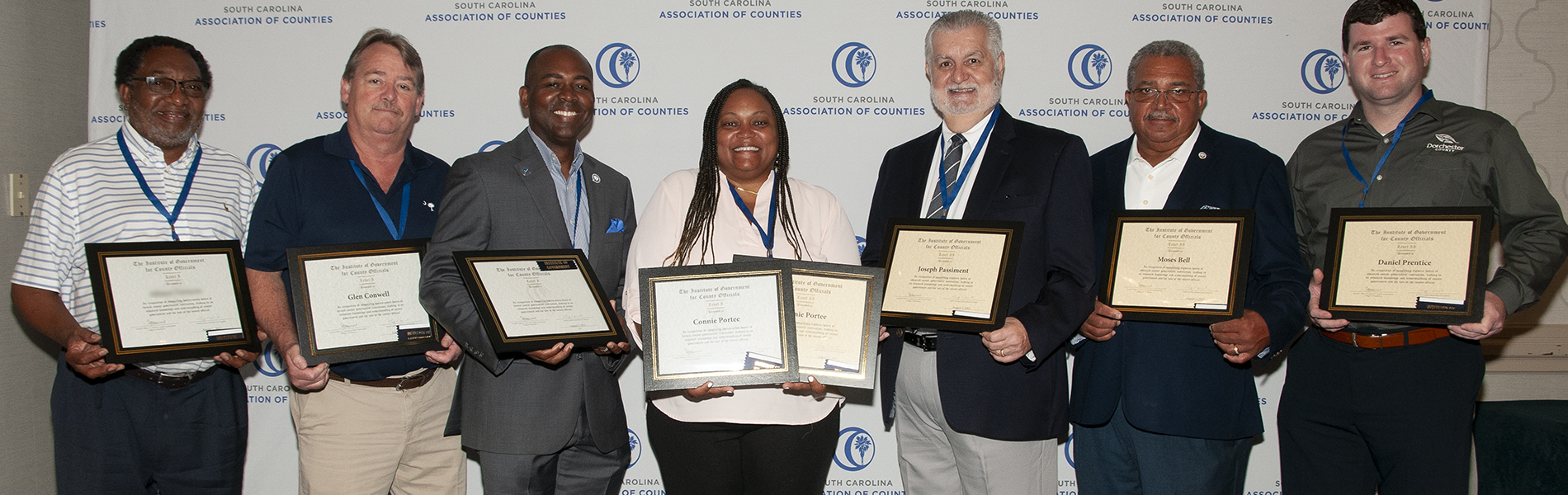 institute graduates holding certificates