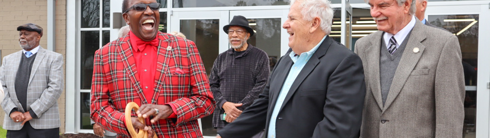 McCormick County Council Chairman Charles Jennings smiles at the crowd gathered for a ribbon cutting.