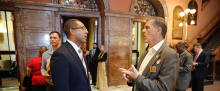 Sen. Kevin Reichenbach speaks with a county official during Counties Connect 2024.