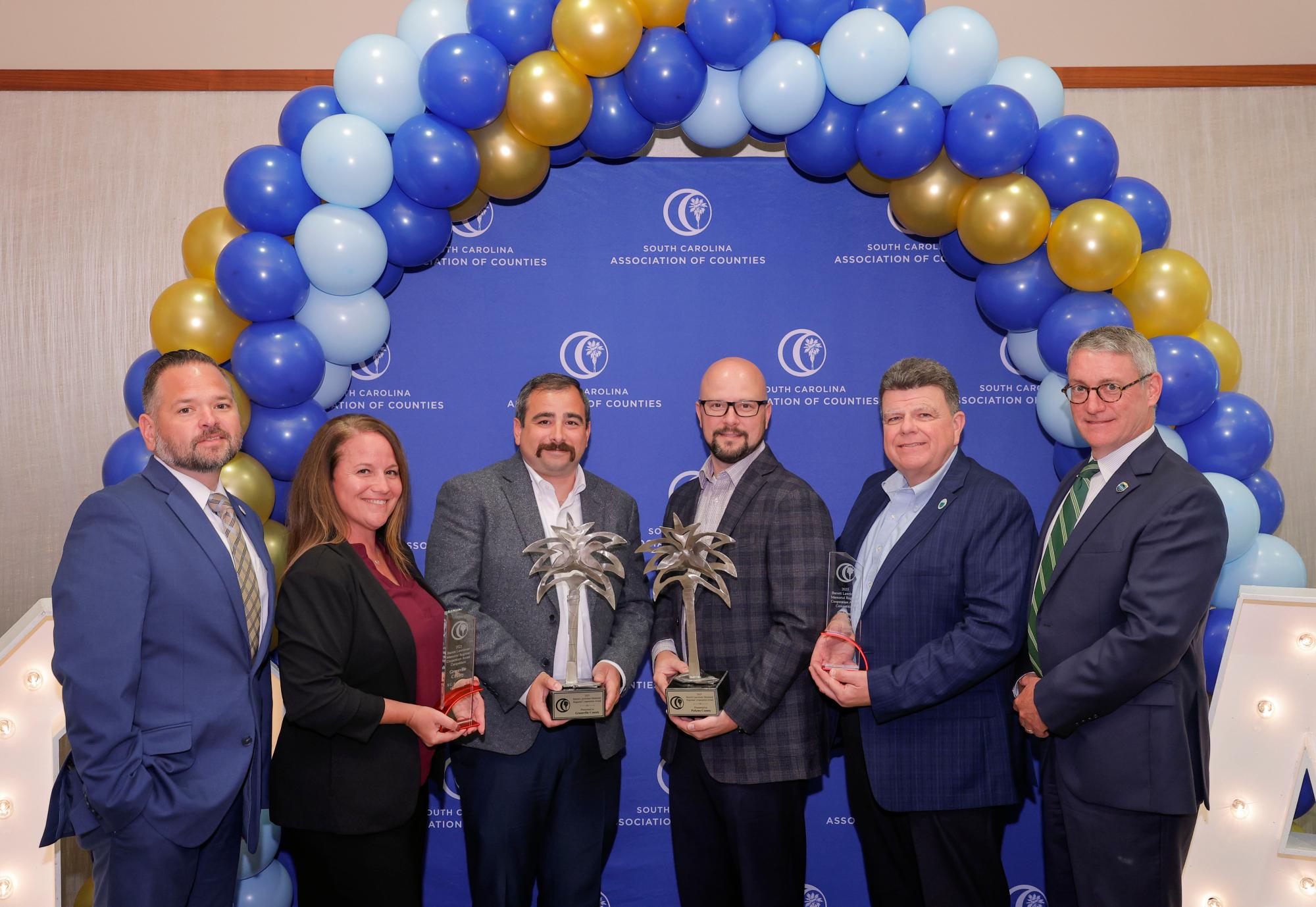 Representatives from Greenville and Pickens counties accept the 2025 Barrett Lawrimore Award.