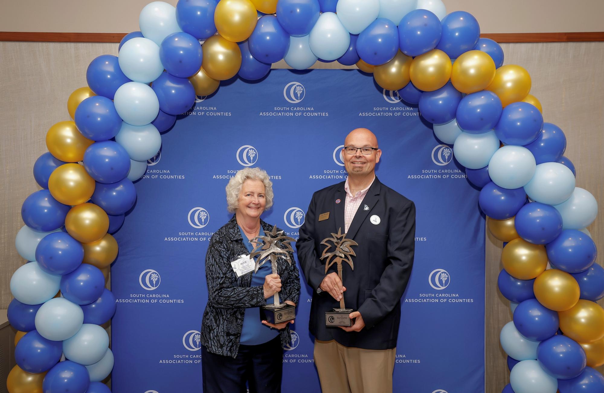 Beaufort County County Council Chairwoman Alice Howard and Jasper County Council Chairman Joey Rowell hold their 2026 Barrett Lawrimore Regional Cooperation Memorial Award.