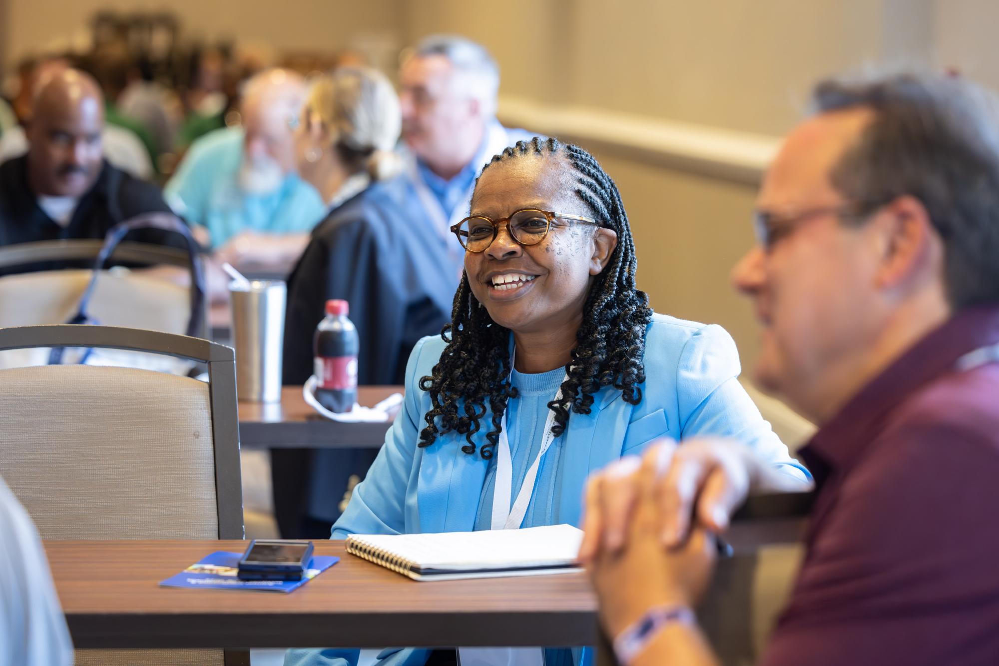 An Institute of Government attendee engages in conversation during a class.
