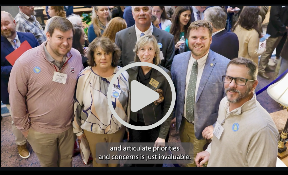 People standing in the State House lobby