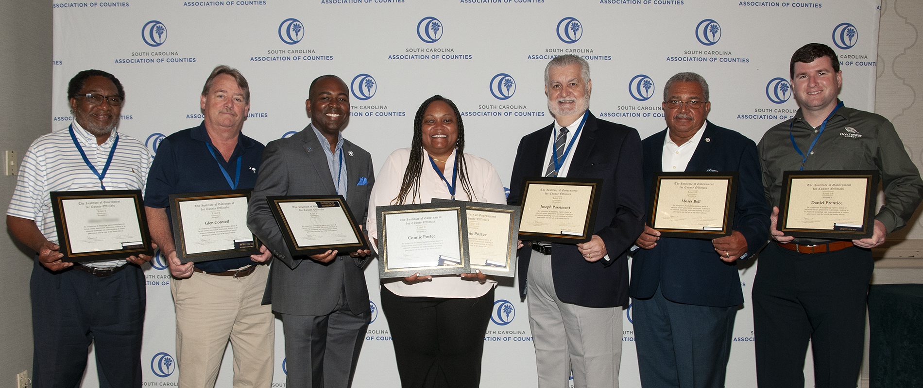institute graduates holding certificates