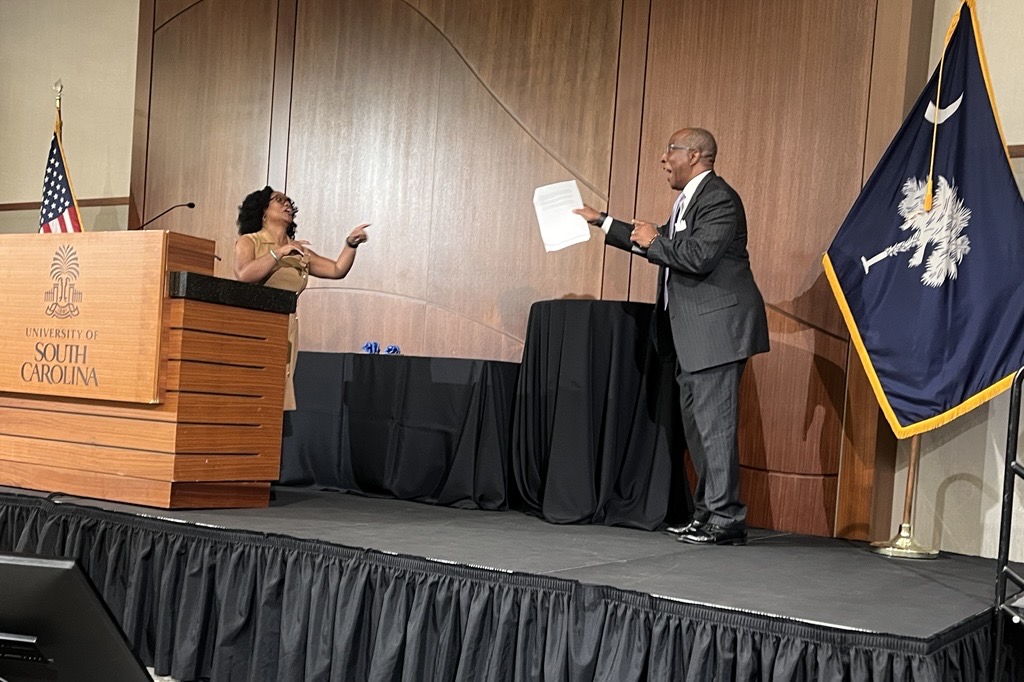 D. Nichole Davis and Kent Lesesne on stage at the 2025 SC Local Government Attorneys' Institute.