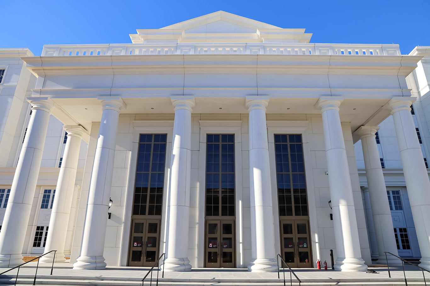 The new Spartanburg County courthouse facade features large white stone columns in a classic style.