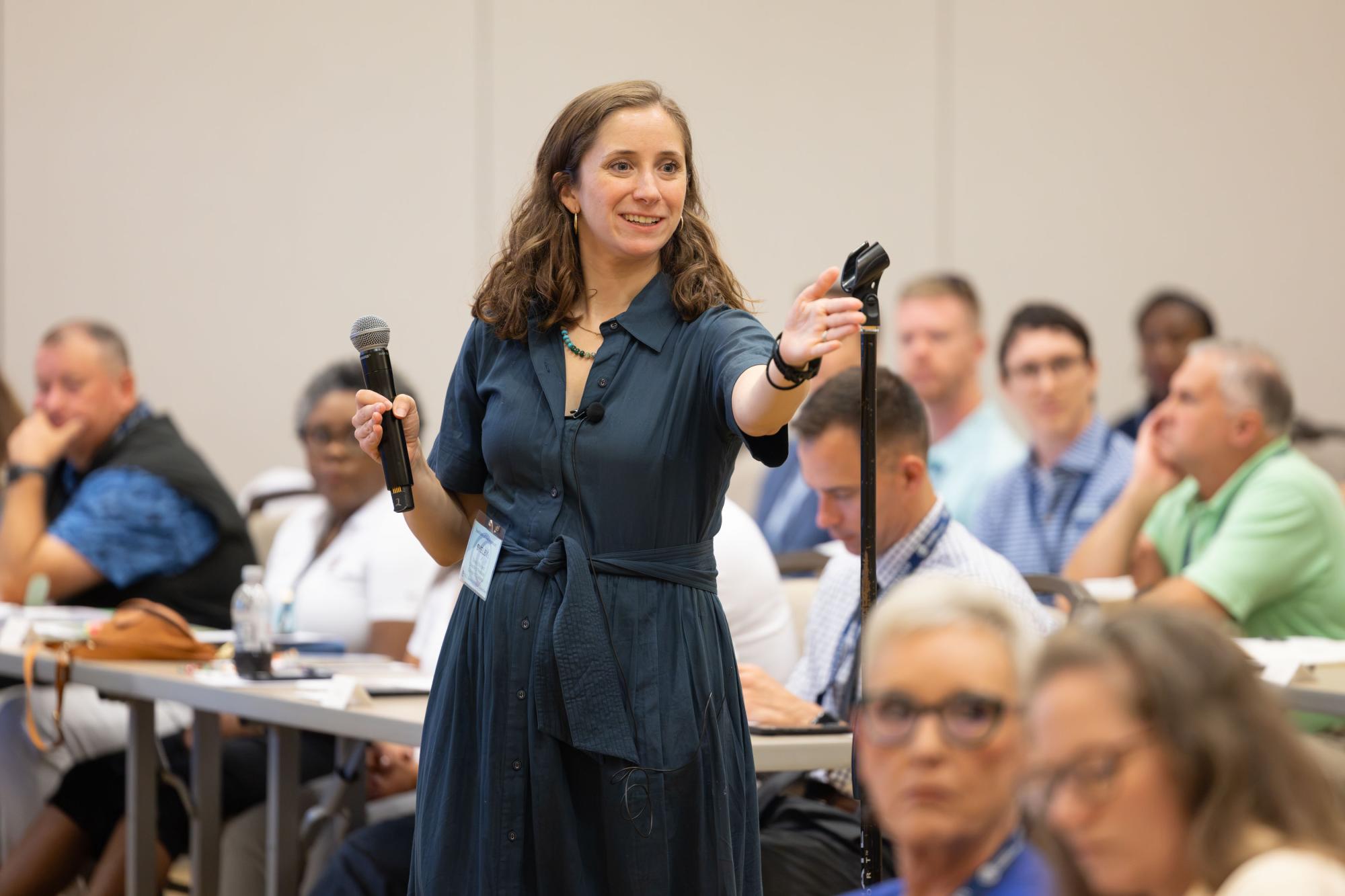 woman speaks at the annual conference