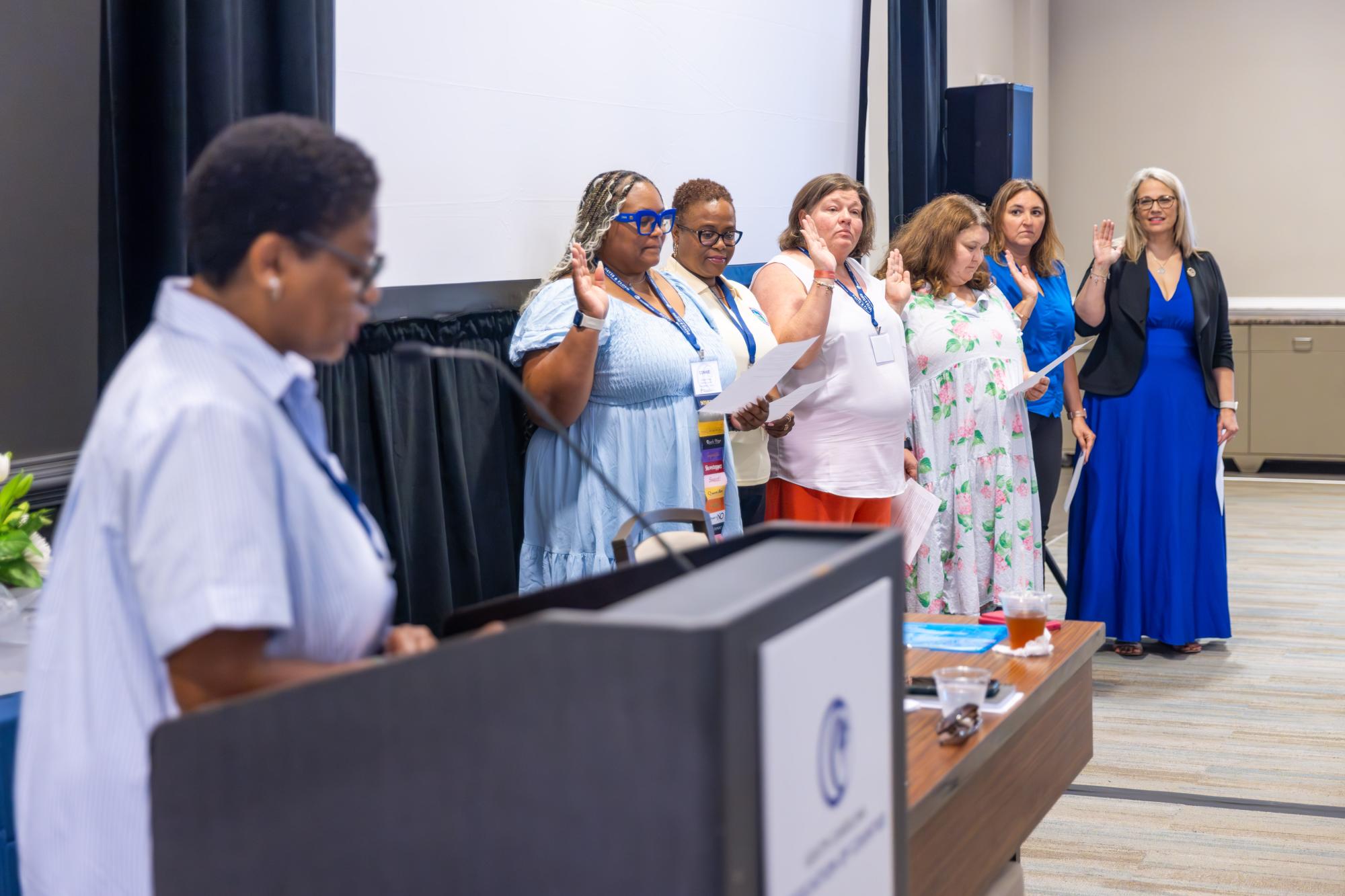 Six officers taking oath of office for association